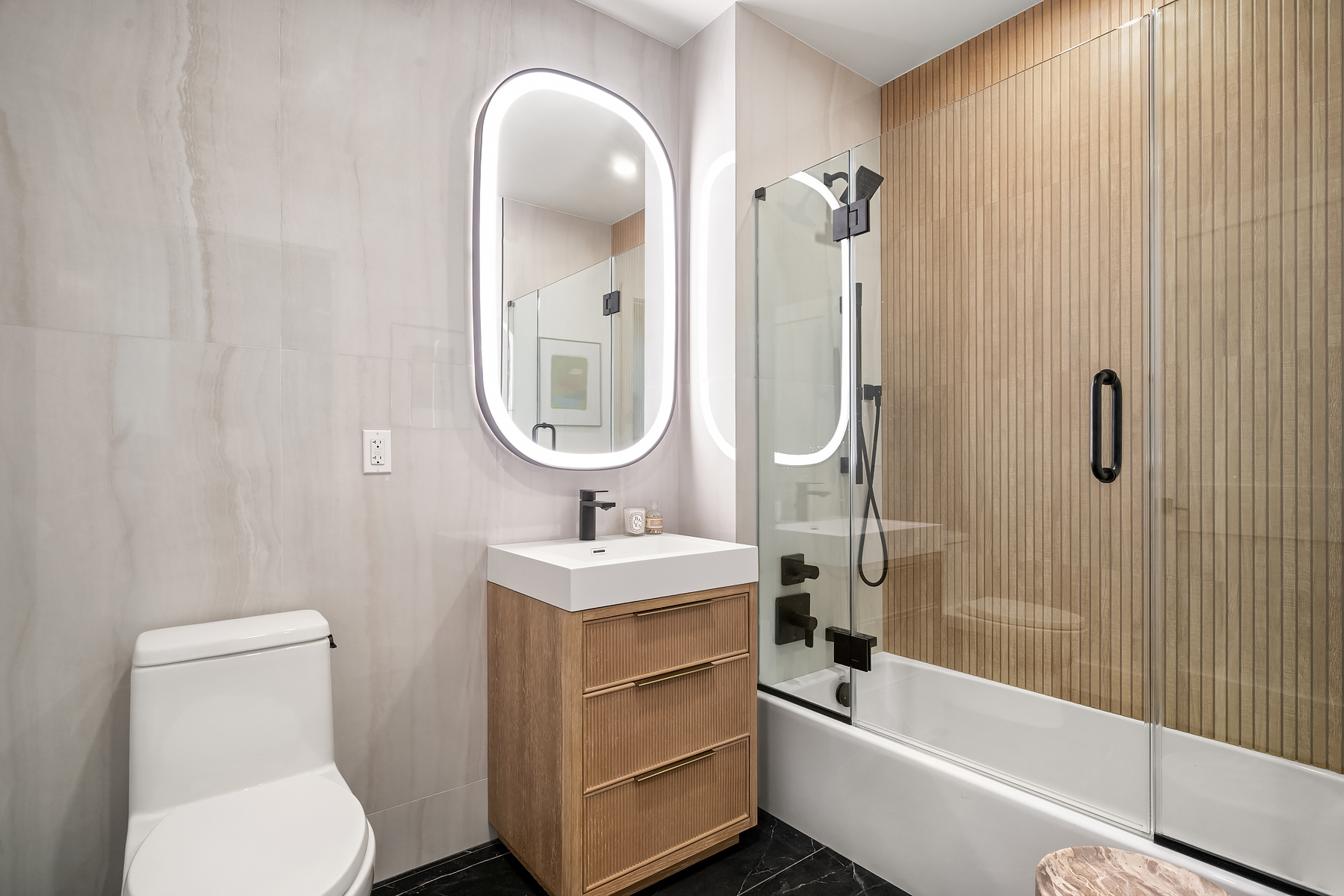 Bathroom with custom vanity and warm finishes